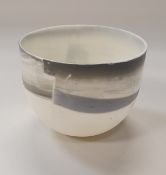 ANNE BUTLER (Contemporary) - a transparent Parian ware bowl decorated with poured grey slips,