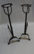 A matched pair of wrought iron andirons with spit holders and ale mullers,