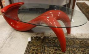 A late 20th Century glass topped desk with Red Wave fibreglass base