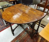 A Charles II oak oval gate-leg drop-leaf dining table of small proportions,