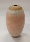 DAVID WHITE (1934-2011) - a porcelain vessel with pink / peach crackle glaze, potter's mark to base,