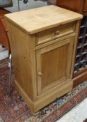 A Continental pine pot cupboard with single drawer over cupboard door,