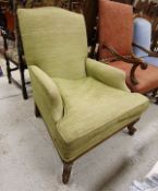 A modern green upholstered armchair on cabriole front legs to scroll feet