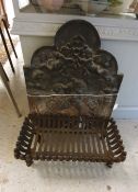 A cast iron fire back with cherub decoration,