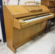 An Art Deco style oak cased Eavestaff pianette/mini piano with matching stool