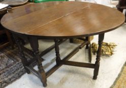 An 18th Century oak gate-leg dining table