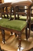 A set of six Victorian mahogany bar back dining chairs with turned and ringed front legs together