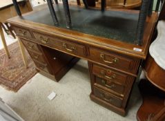 A circa 1900 walnut double pedestal desk with leatherette insert over three drawers to two banks of