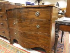 A 19th Century mahogany serpentine fronted chest of three long drawers on bracket feet