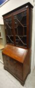 A 19th Century mahogany bureau bookcase with astral glazed top,