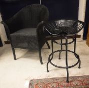 A pair of Eastward Lloyd Loom black painted tub chairs together with a pair of black painted