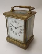 A 19th Century brass mantel clock, the white enamel dial inscribed "Thomson & Profaze,