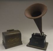 An Edison Gem phonograph with oak casing and tin horn together with a case containing a selection