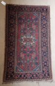 Three old Persian carpets of small proportions, one approx 119 cm x 73 cm,