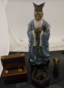 A glazed pottery figure of a Chinese elder, a small reproduction telescope,