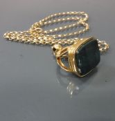 A 19 carat gold hard stone set watch fob of plain rectangular form on a 9 carat gold belcher chain,