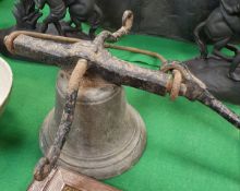 A Victorian bronze bell with wrought iron hanging mount