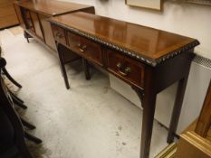 A mahogany and rosewood cross banded side table of slim proportions,
