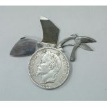 A Napoleon III 1869 5 franc piece coin concealing scissors, knife and file,