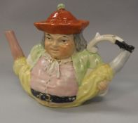 A Victorian pottery Toby teapot as "Peg Leg doing the Splits"