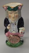 A 19th Century pottery toby jug "Home brewed ale" bearing "Susan and Ian Groom" label to underside