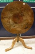A 19th Century French Provincial cherry wood circular drop leaf dining table on turned tapering