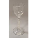 A late 18th/early 19th Century wine glass with ogee bowl on a double series opaque twist decorated