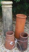 A pair of terracotta chimney pots,