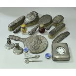 A box containing a pair of silver menu holders with armorial centre inscribed "Presented to The