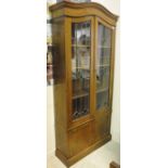 An early 20th Century oak and leaded glazed display cabinet,