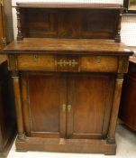 A Regency rosewood chiffonier with shelved superstructure over two drawers and two cupboard doors