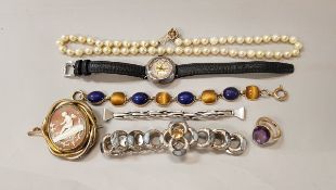 A collection of jewellery to include a cameo brooch, a silver cased ladies wrist watch,