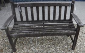 A modern stained teak garden bench