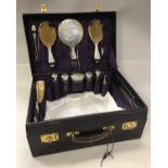 A Walker & Hall purple dyed leather ladies travelling vanity case with silver fittings,