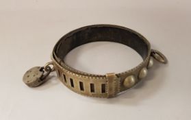 An early 20th Century steel dog collar with lock, stamped "Massey",