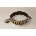 An early 20th Century steel dog collar with lock, stamped "Massey",