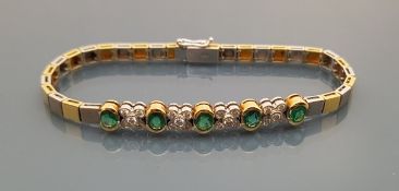 An 18 carat two tone gold emerald and diamond set bracelet, total weight 17.