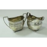 A George III silver cream jug of elongated octagonal form,