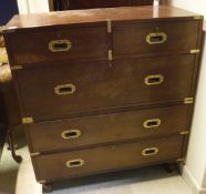 A circa 1900 teak military chest with brass handles (in two sections),