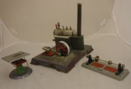 A German tinplate stationary steam engine stamped to base "Made in Germany" together with two