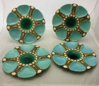 A collection four Minton majolica oyster plates with shell and seaweed decoration three No'd 1323