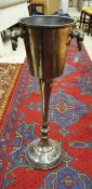 A cast metal floor-standing champagne bucket CONDITION REPORTS There is some