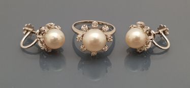 A 14ct white gold cultured pearl and diamond set ring,