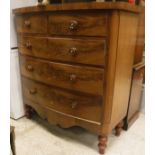 A Victorian mahogany North Country bow fronted chest of two short over three long drawers with