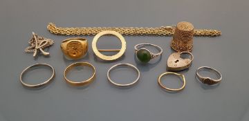 A collection of gold and platinum jewellery to include a brooch, sovereign ring, thimble, necklaces,