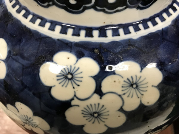 A 19th Century Chinese blue and white prunus blossom decorated baluster shaped vase and cover on a - Image 8 of 24