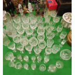 A collection of various cut glassware to include eight hock glasses, two decanters,