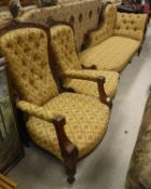 A late Victorian walnut framed chaise longue with matching ladies and gents chairs upholstered in