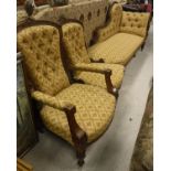 A late Victorian walnut framed chaise longue with matching ladies and gents chairs upholstered in