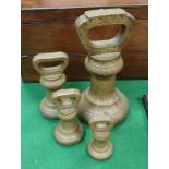 A graduated set of four Avery Ltd brass bell weights 14 lbs, 4 lbs,